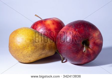 Fresh And Delicious Apple And Pear, Red Ripe Apples. Isolated On Color Background.