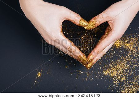 Female Hand Showing Heart Shape Gesture. Fastive Background, Space For Text