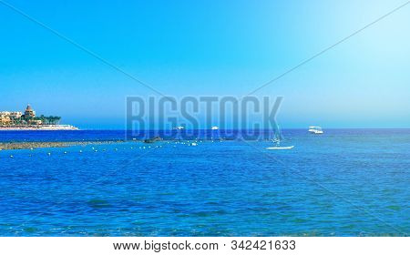 Modern Egyptian City. Seafront Hurghada. View Of Egyptian City Of Hurghada From Red Sea