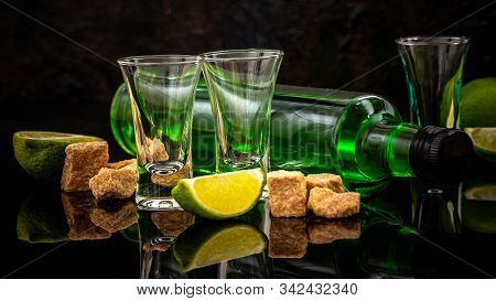 Green Cocktail On The Basis Of Absinthe In A Stylish Vintage Glass. Absinthe In Glass With Lime Slic