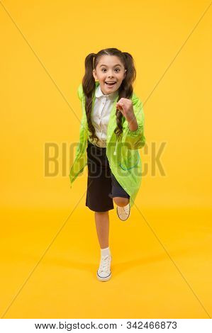 Small Girl Have Fun In Raincoat. Active Schoolgirl Waterproof Cloak. Water Resistant Clothes. In Goo