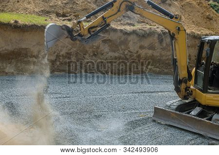 A Excavator In A Working To Gravel Construction Equipment For Foundation Construction Of Residential
