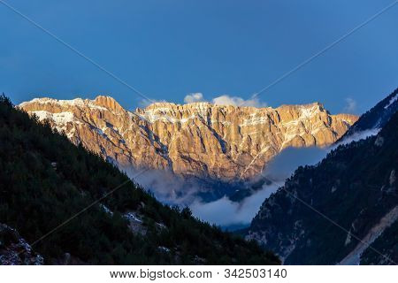 View Of The Mountain Range, Lit By The Rays Of The Sun.
