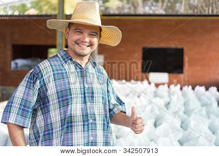 Asian Man Farmer Agriculturist Happy Thumbs Up At A Fertilizer Composting Plant With Organic Fertili