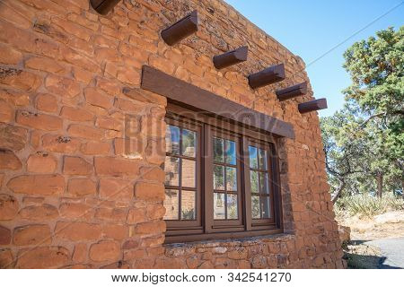 Windows And Vigas In Southwestern Stone Building