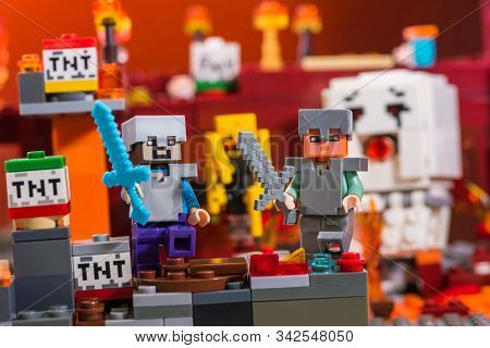 Kiev, Ukraine - December 29, 2019: Minifigure Steve And Alex With Diamond And Iron Swords Running Aw