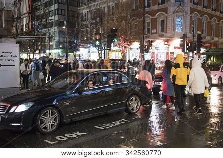 Busy London Street Scene At Oxford Circus With British Flags Decorating Regent Street, A Landmark Re