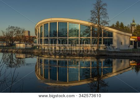 Swimming Hall In Ceske Budejovice Near Vltava River In Sunny Winter Color Evening