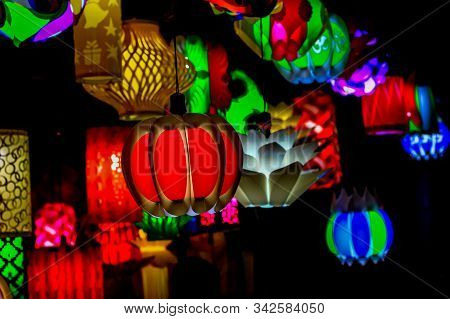 Different Colored Paper Chinese Electric Night Lamp Hanging From The Ceiling On The Occasion Of Chin