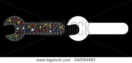 Glossy Mesh Wrench Icon With Glare Effect. Abstract Illuminated Model Of Wrench. Shiny Wire Frame Tr