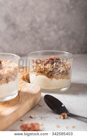 Parfait. Granola Parfait. Delicious Natural Yogurt Parfait With Caramel, Pecan Nuts On Conctere Back