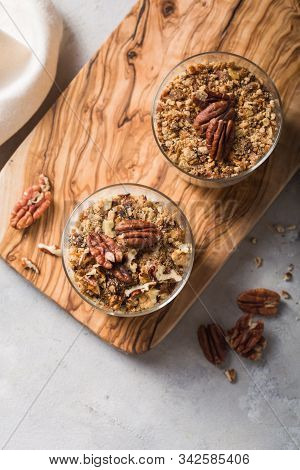 Parfait. Granola Parfait. Delicious Natural Yogurt Parfait With Caramel, Pecan Nuts On Conctere Back