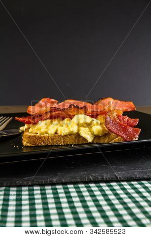 Breakfast Of Bacon And Egg On Toast.