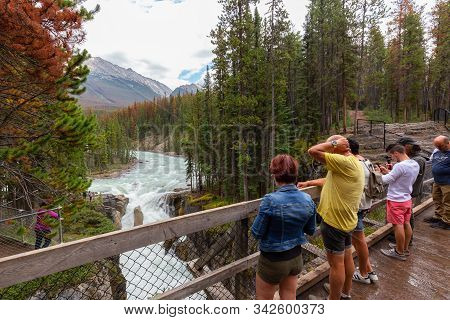 Sunwapta Falls, Jasper National Park, Alberta, Canada - August 15, 2019: People Enjoying A View From