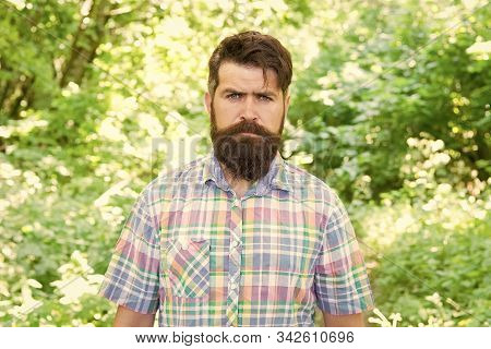Brutal Style Trends. Bearded Man With Brutal Look On Natural Landscape. Caucasian Guy With Long Brut