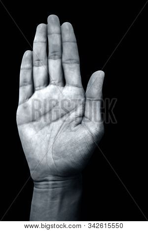 Isolated Pair Of Hands Of A Male Teenager On Black Background Doing Abhayaprada Yoga Mudra.vertical 