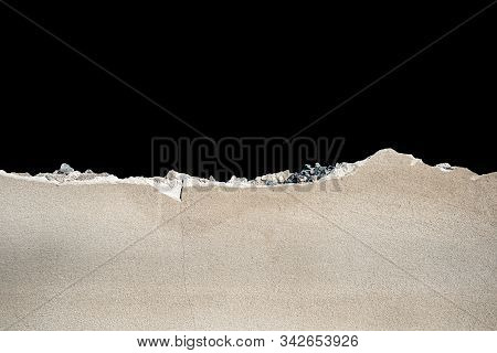 The Wall Of A Cement That Was Smashed Isolate On Black Background