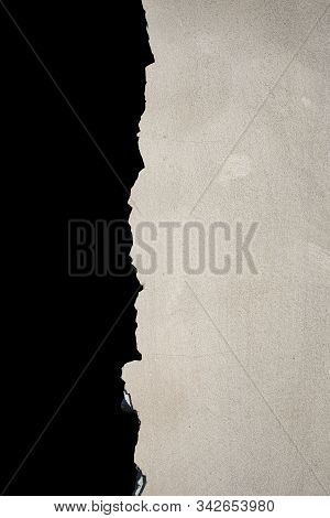 The Vertical Wall Of A Cement That Was Smashed Isolate On Black Background