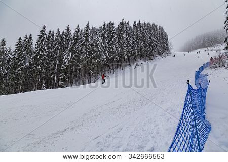 Ski Centre Rohace - Spalena, Zuberec, At Winter. Western Tatras. Slovakia. Skiers Skiing On The Slop