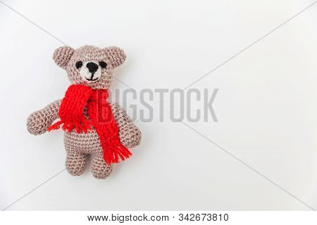 Simply Minimal Design With Toy Bear In Red Scarf Isolated On White Background. Children Care Materin
