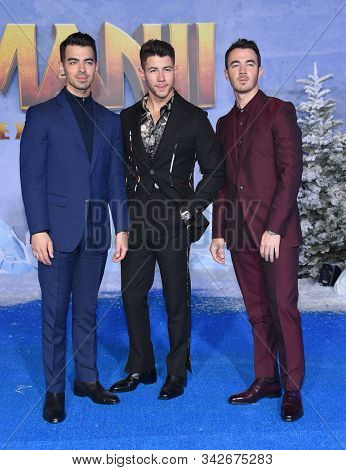 LOS ANGELES - DEC 09:  Jonas Brothers arrives for the ÃJumanji: The Next LevelÃ Los Angeles Premiere on December 09, 2019 in Hollywood, CA                
