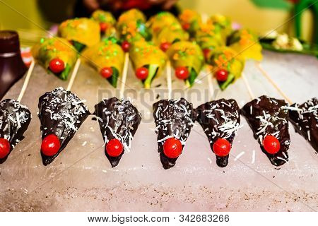 Cone Of Chocolate Flavored Betel Leaf On Ice Stuffed With Cherry Known As Mango Paan With Selective 