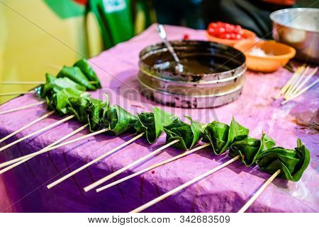 Cone Of Betel Leaf Being Coated With Chocolate Syrup To Form Chocolate Paan With Selective Focus And