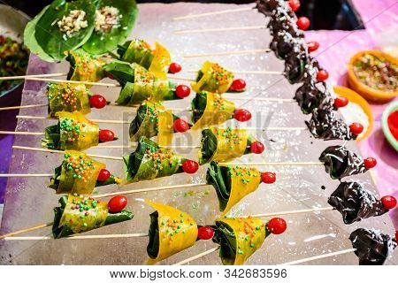 Cone Of Mango Flavored Betel Leaf Stuffed With Cherry Known As Mango Paan With Selective Focus And B