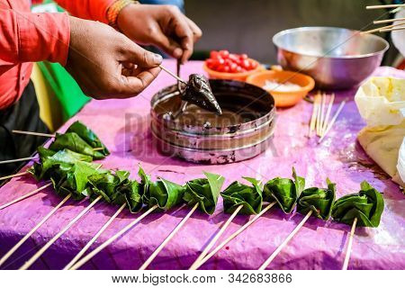 Cone Of Betel Leaf Being Coated With Chocolate Syrup To Form Chocolate Paan With Selective Focus And
