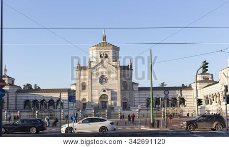 Milan, Italy - January 01, 2020: Exterior Of Cimitero Monumentale Of Milano In Milan; Cars Passing B