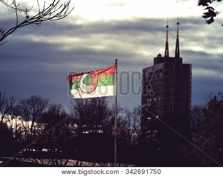Augsburg, Germany - December 15, 2019: Illuminated Flag Of The Soccer Club Fc Augsburg Flatters In T