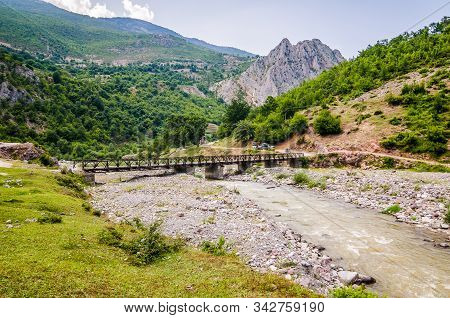 Old Bridge Above Black Drin River Near Village Malqene In Albania