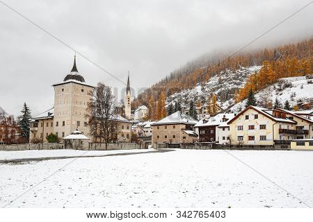 Village Zernez In Winter. View Of The Ancient Wildenberg Castle Against The Background Of Snowy Swis