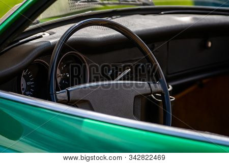 Antique Green Car Steering Wheel And Black Dashboard Close Up, Simple Old Style Cars Interior, Speed