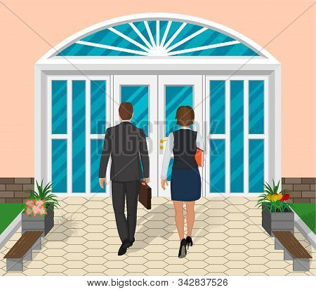 Two People Walk Into The Doors Of The Building.a Business Man And A Business Woman Go To Work.design