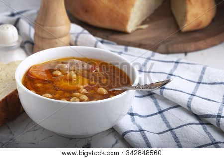 Soup With Chicken, Peas, Tomato And Sliced Carrots. Tasty Hot Soup.