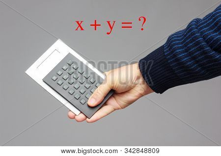 Calculator In The Hand Of An Adult