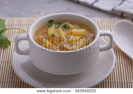 Soup With Chicken, Carrots, Potatoes And Pasta In The Form Of Stars.