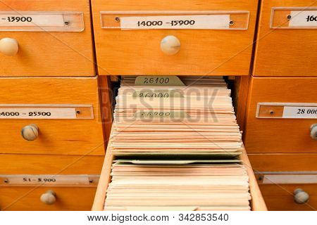 File Cabinet With Library Or Office. One Box Is Open. Database Concept. Library Card Or File Catalog