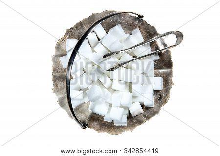 Sugar Cubes In Metal Vintage Sugar  Bowl With Sugar Tongs Isolated On White Background Top View.
