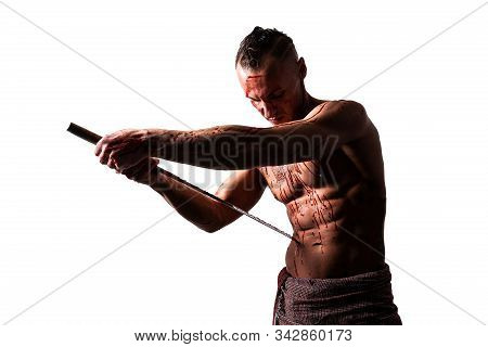 A Man With A Katana, In Blood, Makes Hara-kiri. Isolated On A White Background.