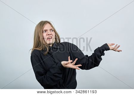 Disappointed Young Woman In Fashion Black Shirt Isolated On Gray Background In Studio Spreads Hands 