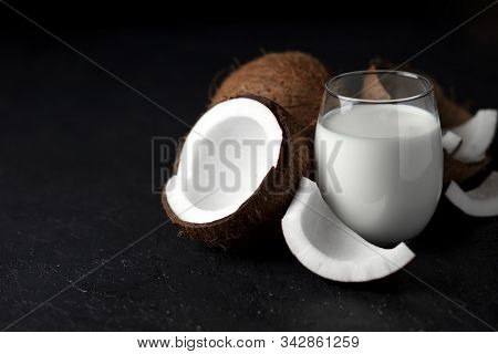 Fresh Coconut Milk In A Glass Against A Dark Background, Coconut Cosmetic Cream, Milkshake With Coco