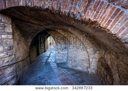Street With Arches And Vaults In Via Gobetti Inside The Historic Center Of Gubbio, A Medieval Town I