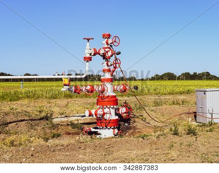 Well For Oil And Gas Production. Oil Well Wellhead Equipment. Oil Production.