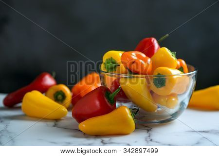 Colourful Mini Sweet Peppers In A Glass Bowl