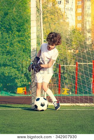 Childrens Soccer Football - A Match Of Young Children On The Football Field