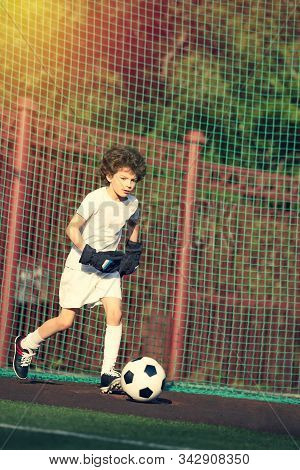 Childrens Soccer Football - A Match Of Young Children On The Football Field