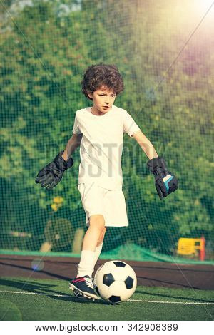 Childrens Soccer Football - A Match Of Young Children On The Football Field