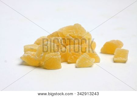 A Pile Of Yellow Succades Isolated On White Background. Image Contains Copy Space
